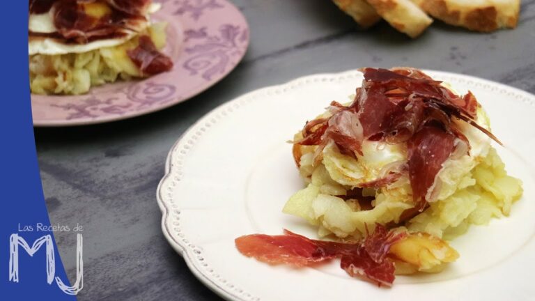 Huevos rotos con patatas y jam&oacute;n