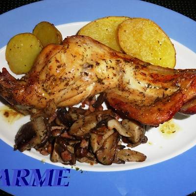 Asado de carne de conejo con patatas